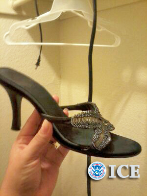 A human trafficking victim placed this black high-heeled shoe on the   window sill of a Tulsa apartment so HSI special agents could confirm her   location and obtain a search warrant for the apartment.