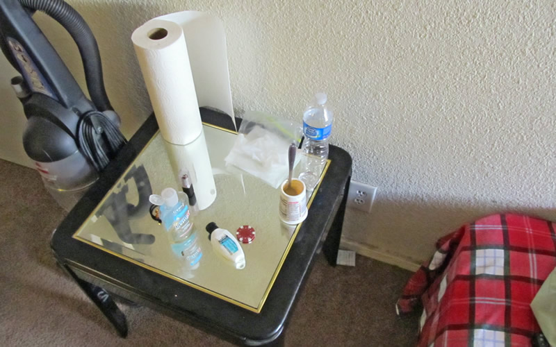 This is the night stand of a human trafficking victim, which shows a   poker chip immediately following the execution of the first search warrant   during Operation Poker Chip.  The operation name is derived from the poker   chips that were given to the customers who paid a 'caretaker' to have sex with a   sex trafficking victim.
