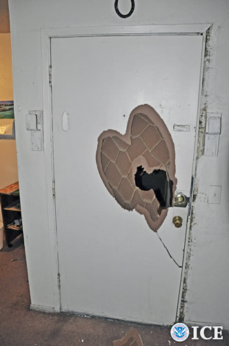 A fortified door to one of the brothels that was broken into by HSI special   agents and task force officers from Tulsa County Sheriff's Office during   Operation Poker Chip.