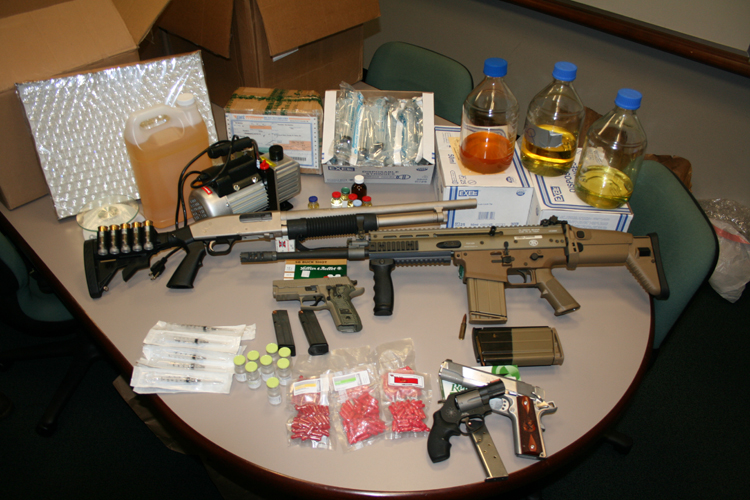 Chemicals, pills and weapons seized following discovery of suspected steroids lab