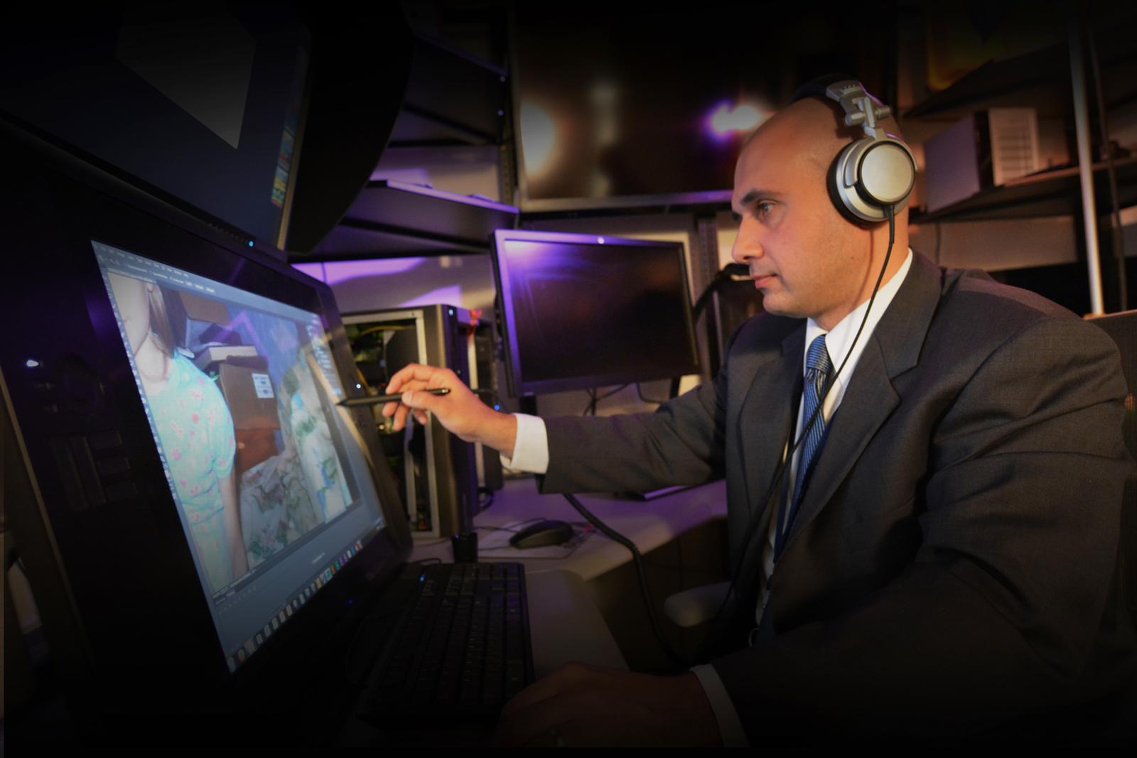 An agent reviewing an image on his computer