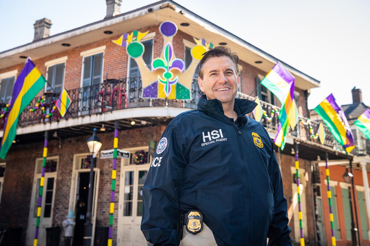 HSI Agent in front of decorated balcony