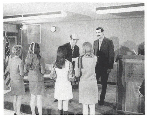 The first four female customs security officers receive congratulations from Treasury Secretary Eugene Rossides at a graduation ceremony in 1971 (picture provided by U.S. Customs and Border Protection).