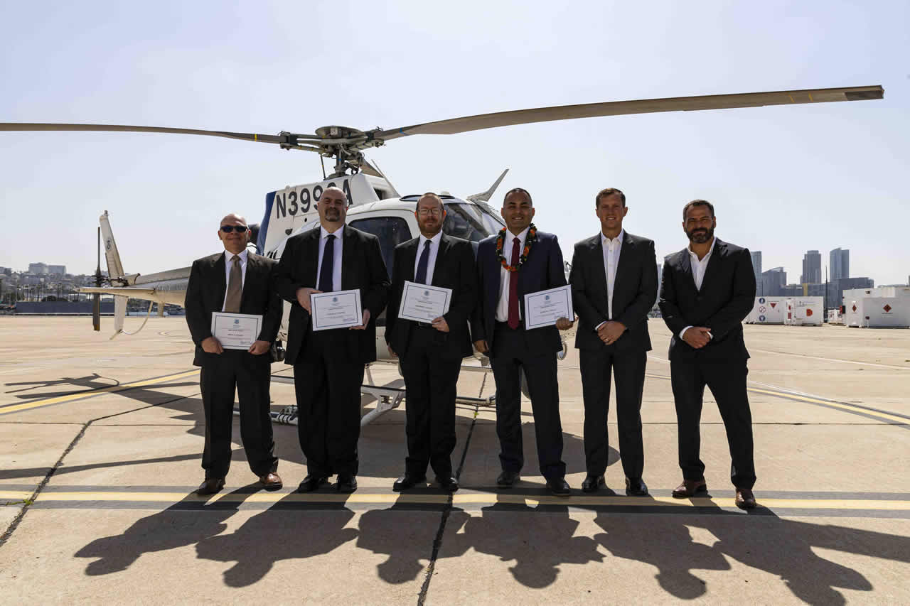 Left to right: Special Agent Brent H. Moores, Special Agent Stirling A. Campbell, Cyber Security Specialist Benjamin J. Lockyer, Group Supervisor Ethan A. Cramer, and HSI San Diego Special Agent in Charge Chad Plantz pose for a photo following an awards ceremony at U.S. Coast Guard Air Station San Diego, April 29.