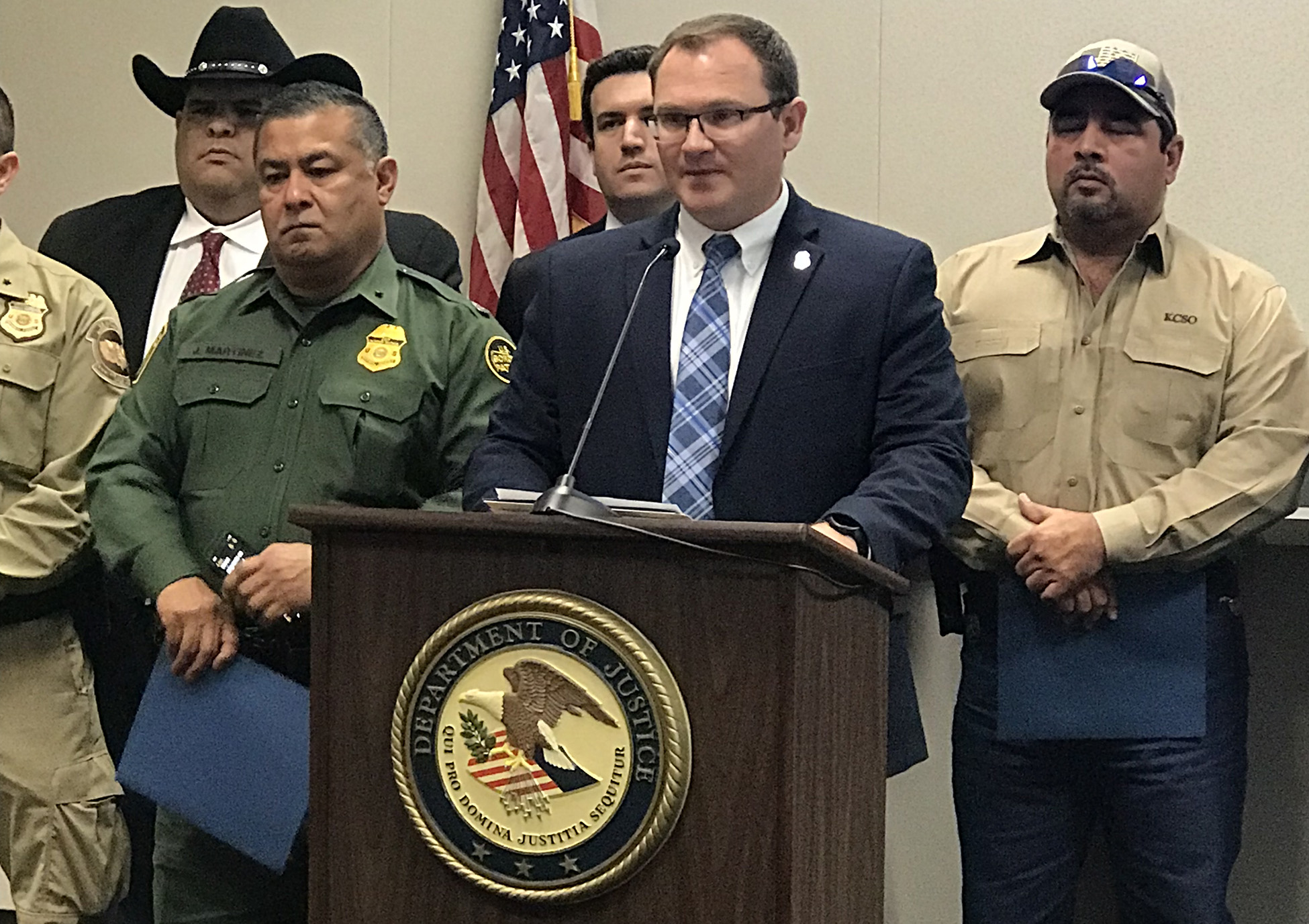 HSI San Antonio Acting Special Agent in Charge Craig Larrabee at the podium providing remarks during the USAO Southern District of Texas boating press conference. He provided information regarding HSI’s role in the investigation that led to the arrest of six suspects.