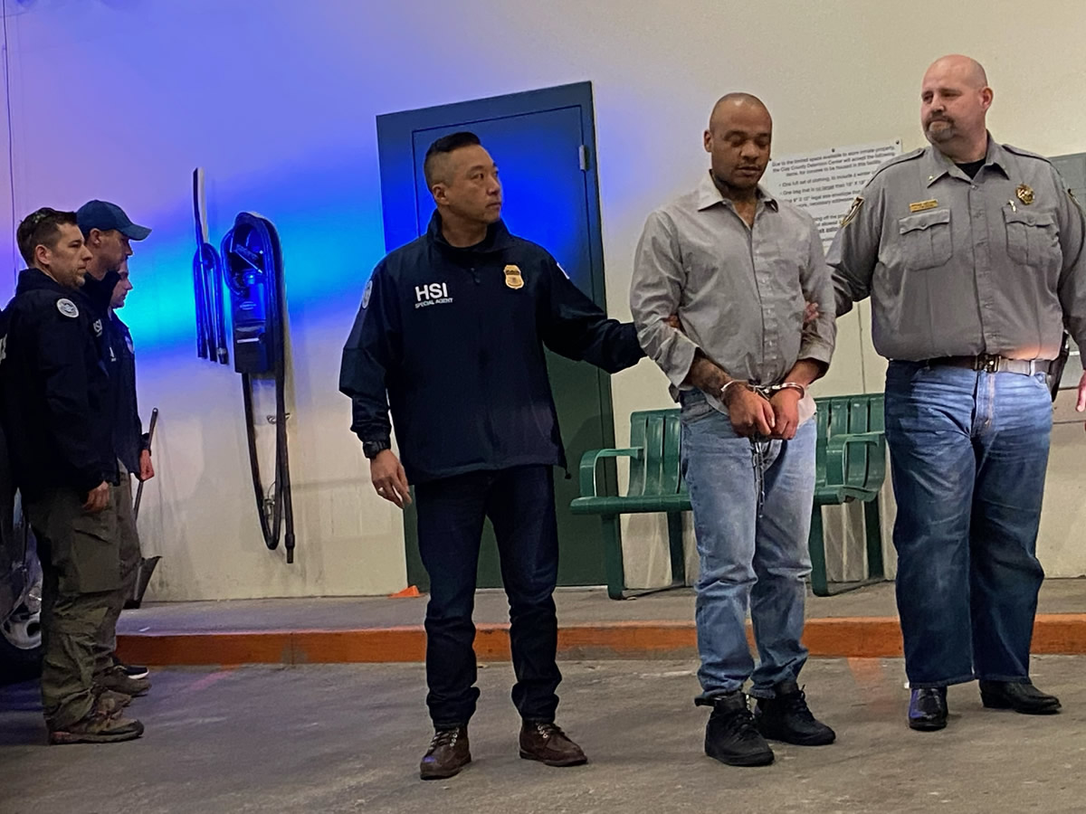 Acting Special Agent in Charge of HSI Kansas City Taekuk Cho, HSI KC special agents and Ray County Sheriff Scott Childers transfer Robinson to Clay County authorities April 7.
