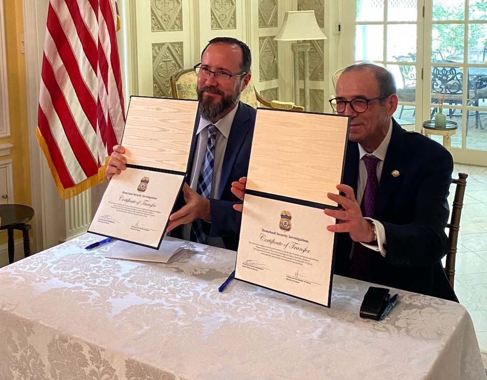 HSI International Operations Deputy Assistant Director Ricardo Mayoral and H.E. Mr. Marios Lysiotis, ambassador of Cyprus at the Embassy of the Republic of Cyprus in Washington D.C., sign a certificate of transfer for Cypriot pottery during a repatriation ceremony April 20, 2023.