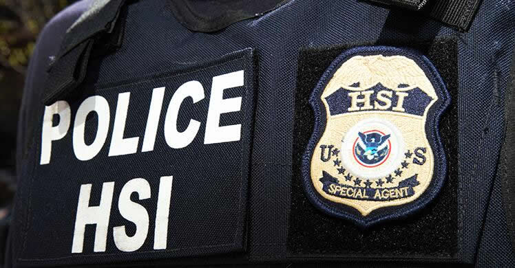 HSI police vest with badge