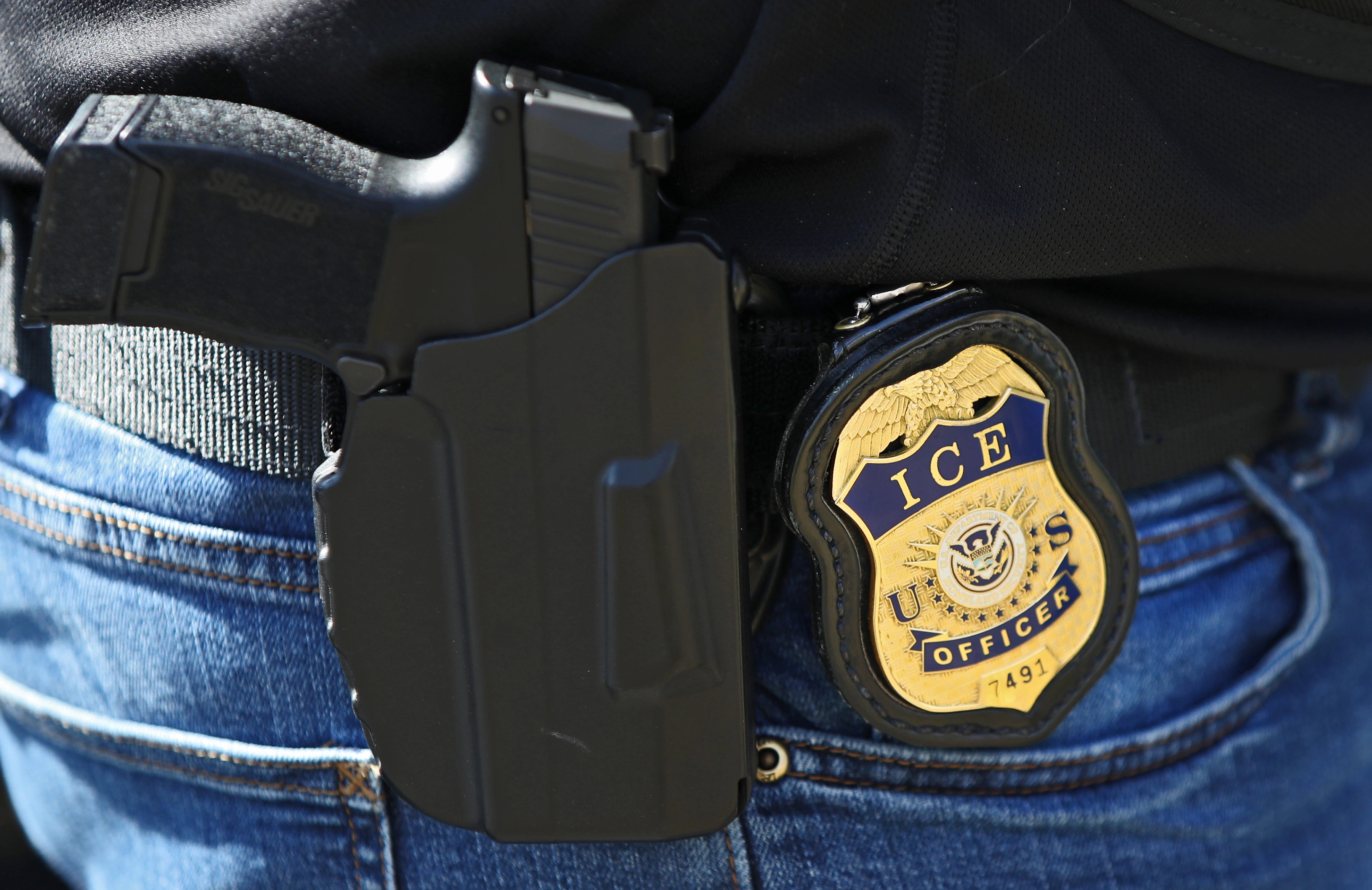 Officer Badge and Holstered gun