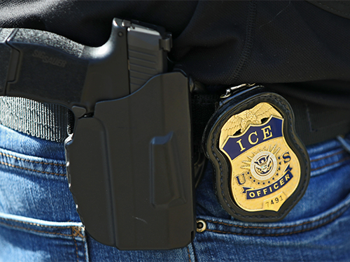 Officer Badge and Holstered gun