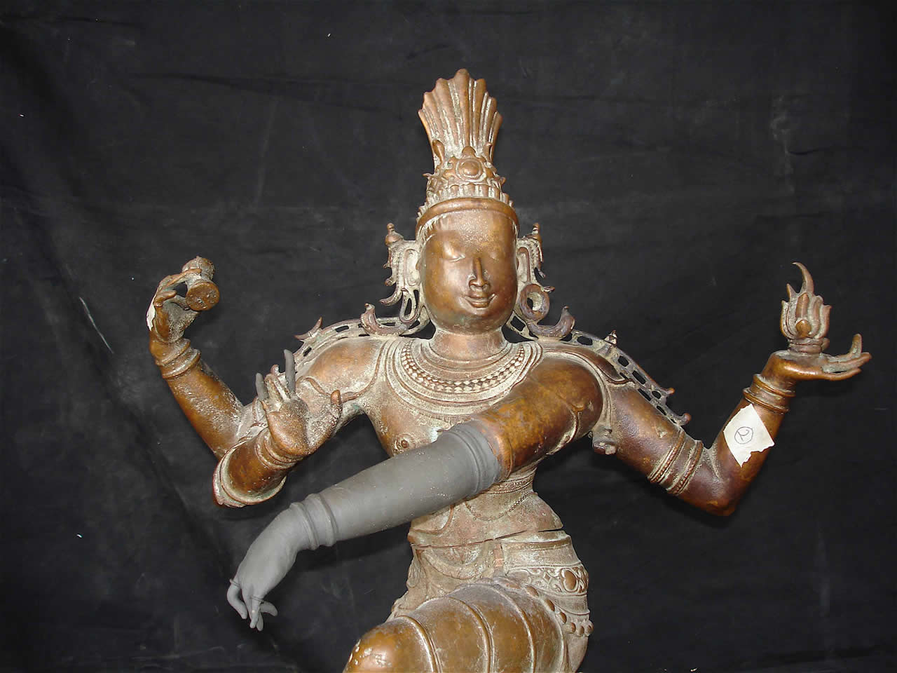 Shiva Nataraja arm being repaired