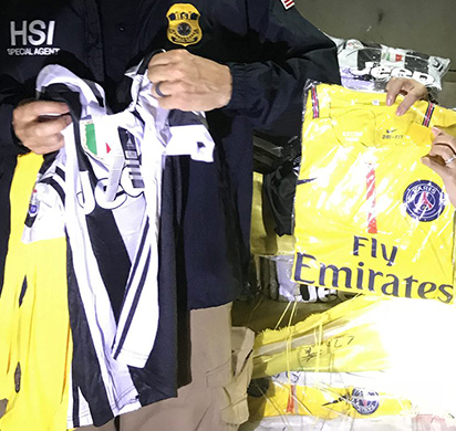 HSI Ho Chi Minh City, along with Vietnamese agents, display counterfeit goods that were destroyed in a mass operation on September 3, 2018.