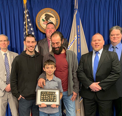 Present for the return ceremony :(Left to right) U.S. Attorney for Rhode Island Aaron L. Weisman, Wheeler family members, HSI Providence Special Agent Michael Polouski and HSI Tacoma (Washington) Special Agent Michael Roots; standing in rear : HSI Providence Resident Agent In Charge Bryan Lewis.