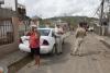 Special agents and technical enforcement officers from the ICE HSI Dallas RRT conduct welfare checks on residents in Barrio Playa, Añasco.